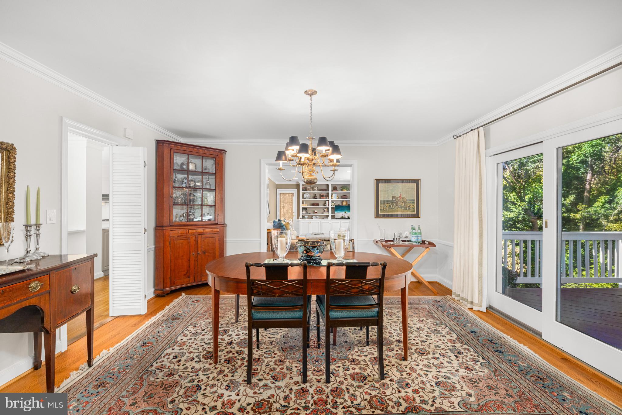 3730 Cardiff Road Chevy Chase, MD 20815 - Photo 11 of 49 a dining room with furniture a chandelier and wooden floor