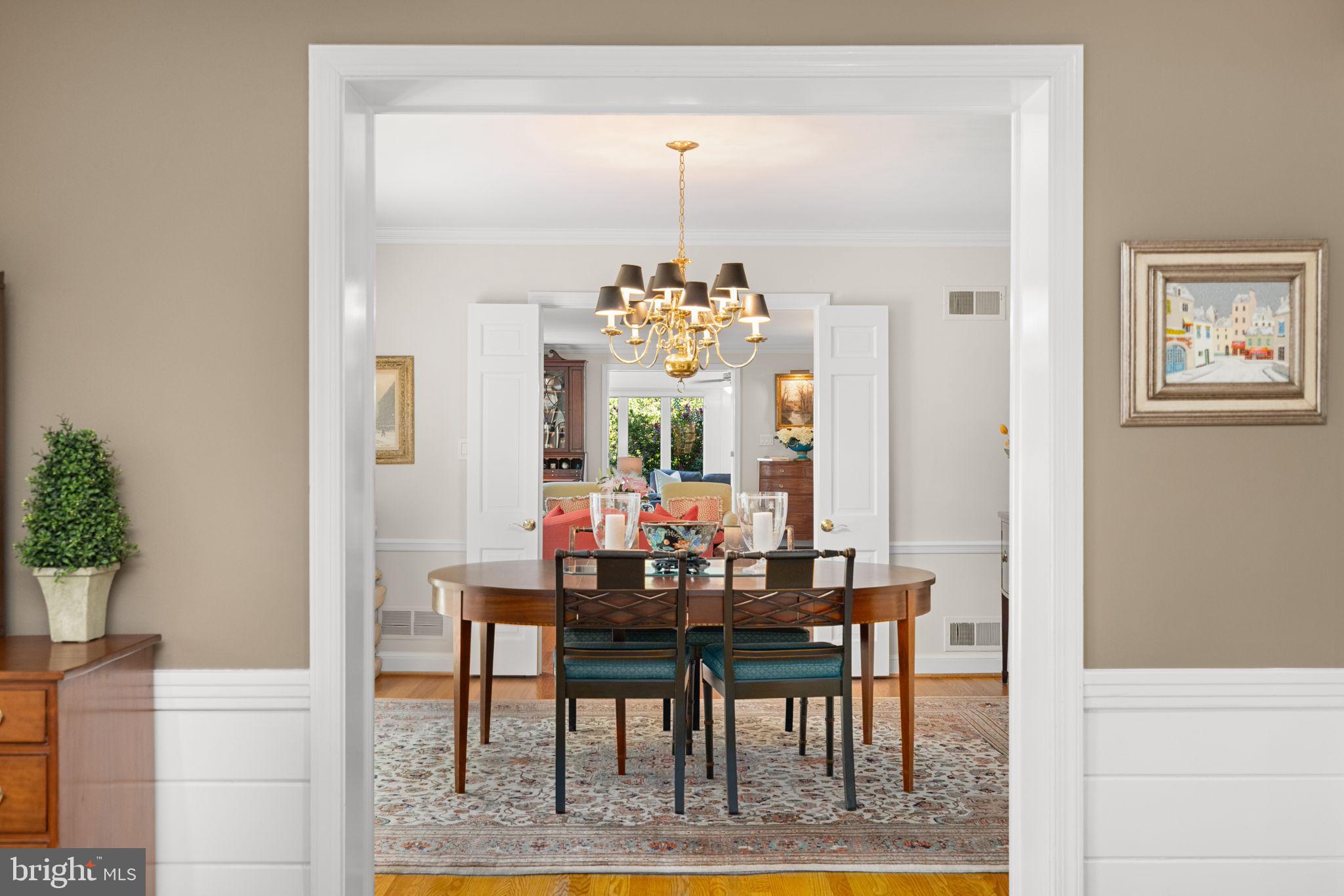 3730 Cardiff Road Chevy Chase, MD 20815 - Photo 12 of 49 a view of a dining room with furniture and chandelier