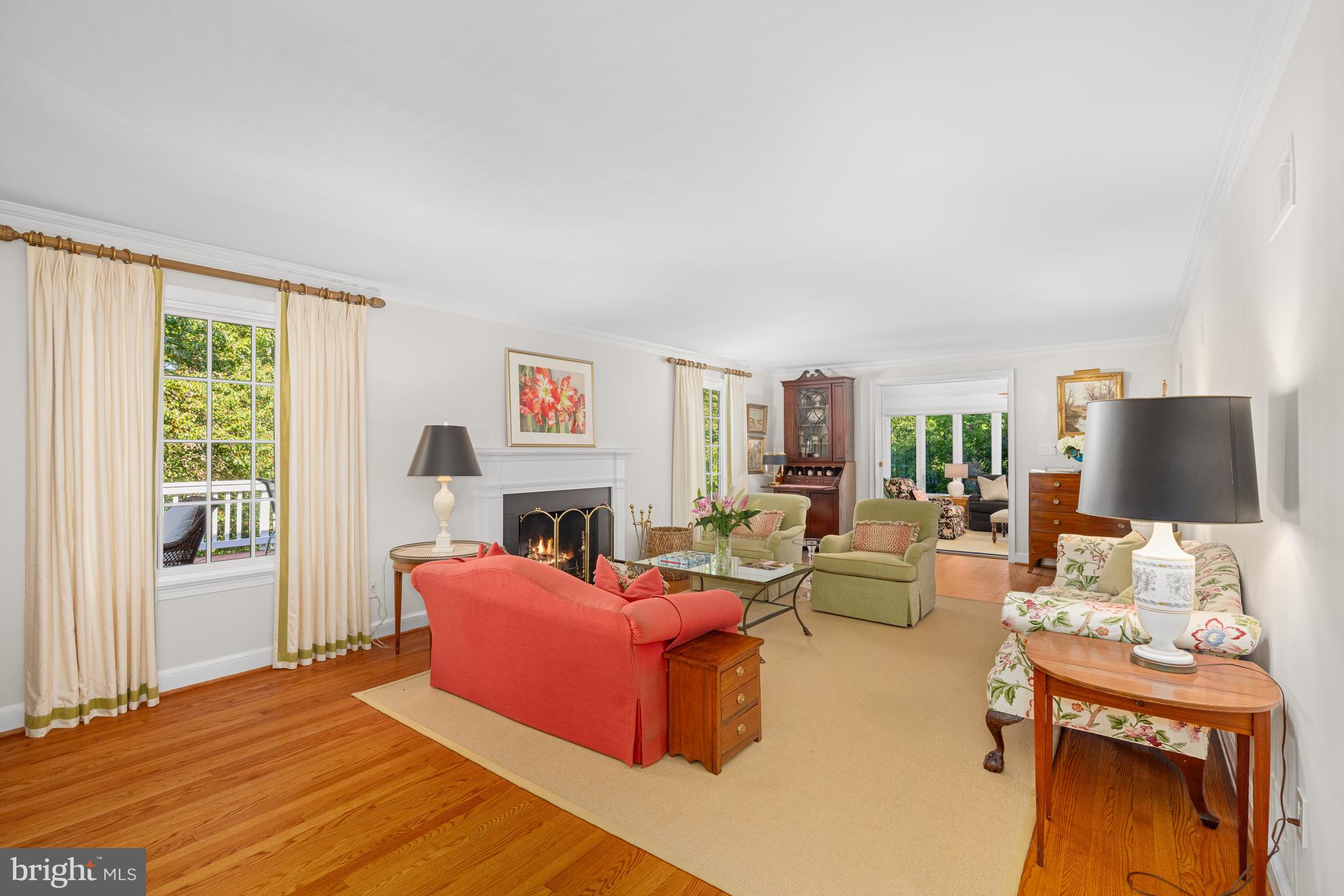 3730 Cardiff Road Chevy Chase, MD 20815 - Photo 16 of 49 a living room with furniture a large window and a flat screen tv