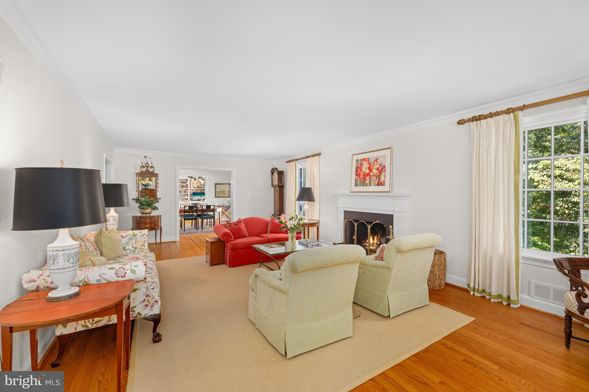 3730 Cardiff Road Chevy Chase, MD 20815 - Photo 17 of 49 a living room with furniture a fireplace and a flat screen tv