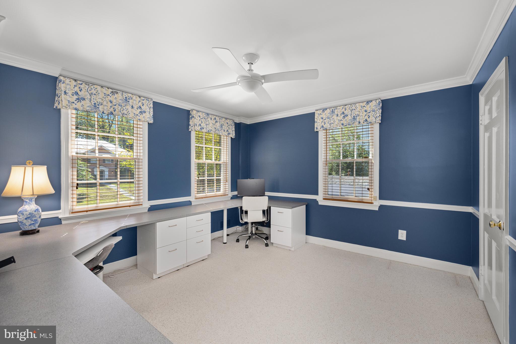 3730 Cardiff Road Chevy Chase, MD 20815 - Photo 28 of 49 a large white room with a large window and couch