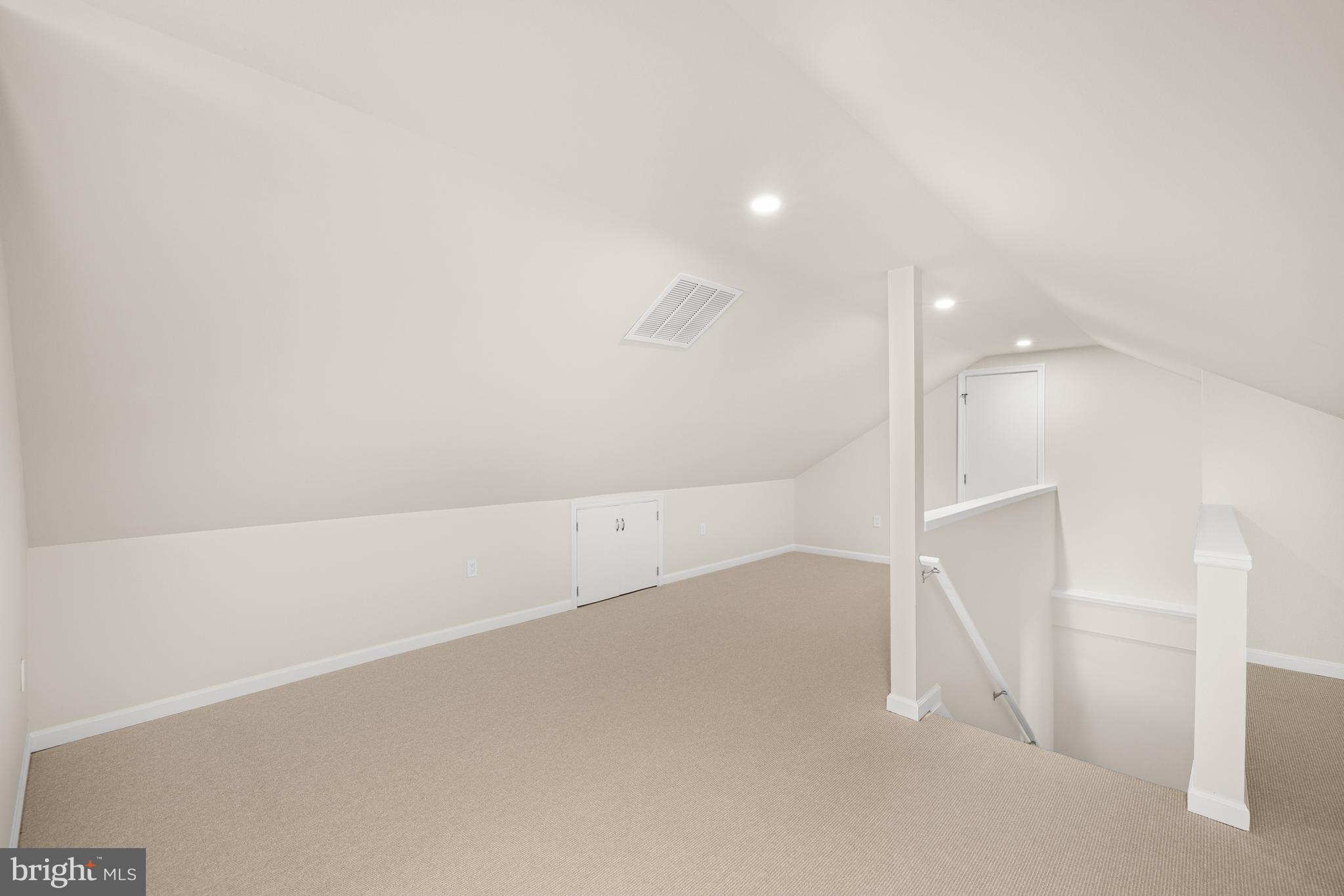 3730 Cardiff Road Chevy Chase, MD 20815 - Photo 34 of 49 an empty room with a white wall and an entryway