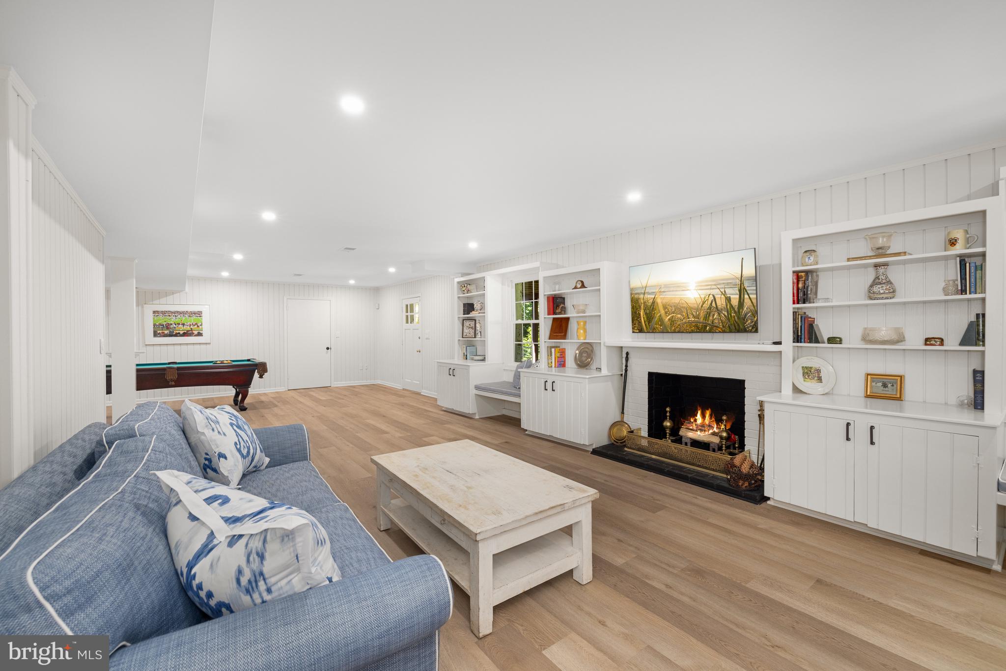 3730 Cardiff Road Chevy Chase, MD 20815 - Photo 37 of 49 a living room with furniture and a fireplace