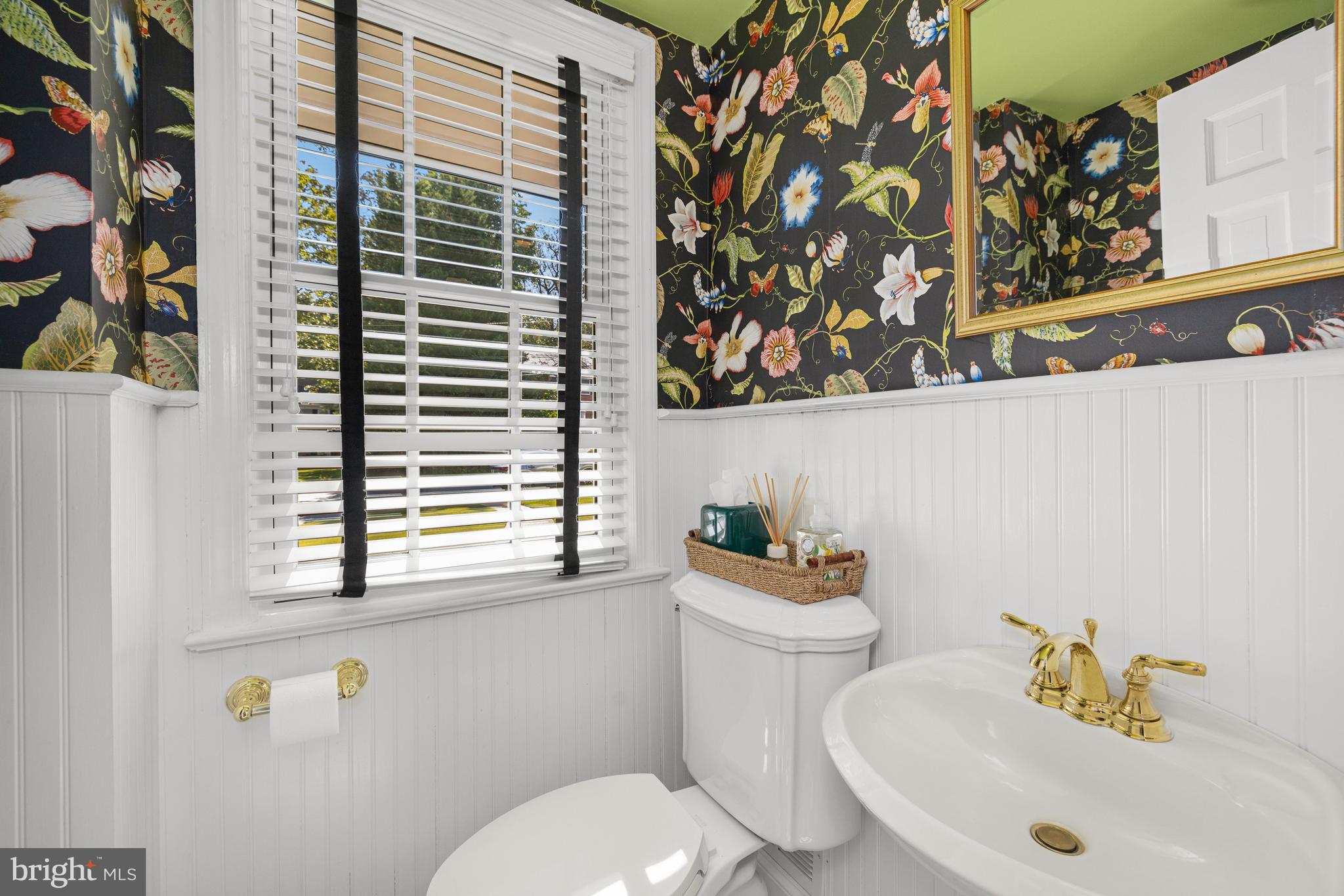 3730 Cardiff Road Chevy Chase, MD 20815 - Photo 4 of 49 a white toilet sitting next to a bathroom sink