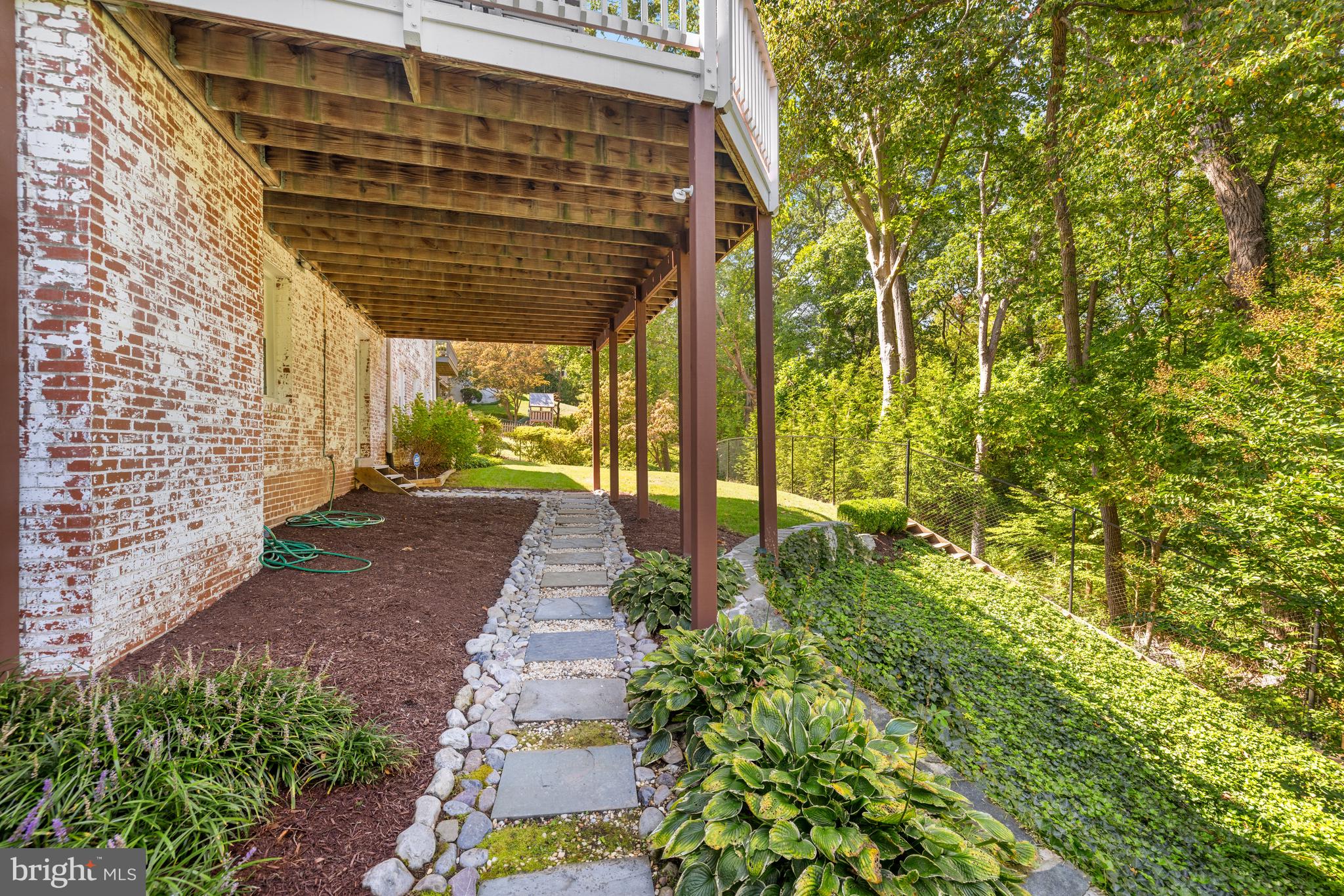 3730 Cardiff Road Chevy Chase, MD 20815 - Photo 46 of 49 a view of a pathway with a tree in the back yard