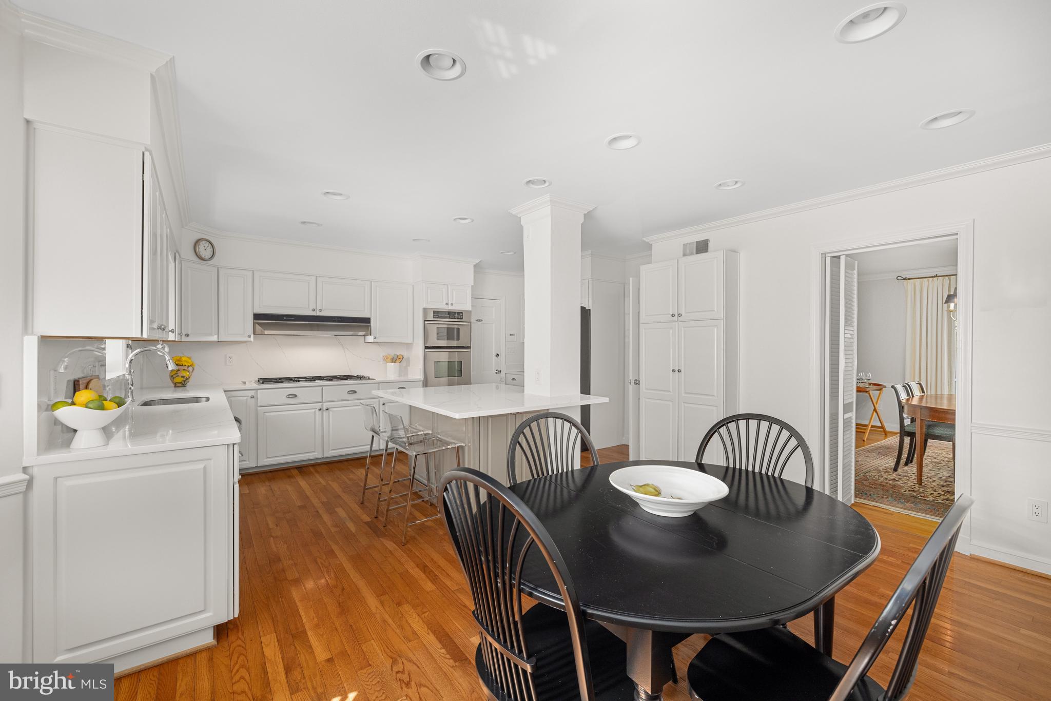 3730 Cardiff Road Chevy Chase, MD 20815 - Photo 6 of 49 a living room with stainless steel appliances furniture a dining table and chairs