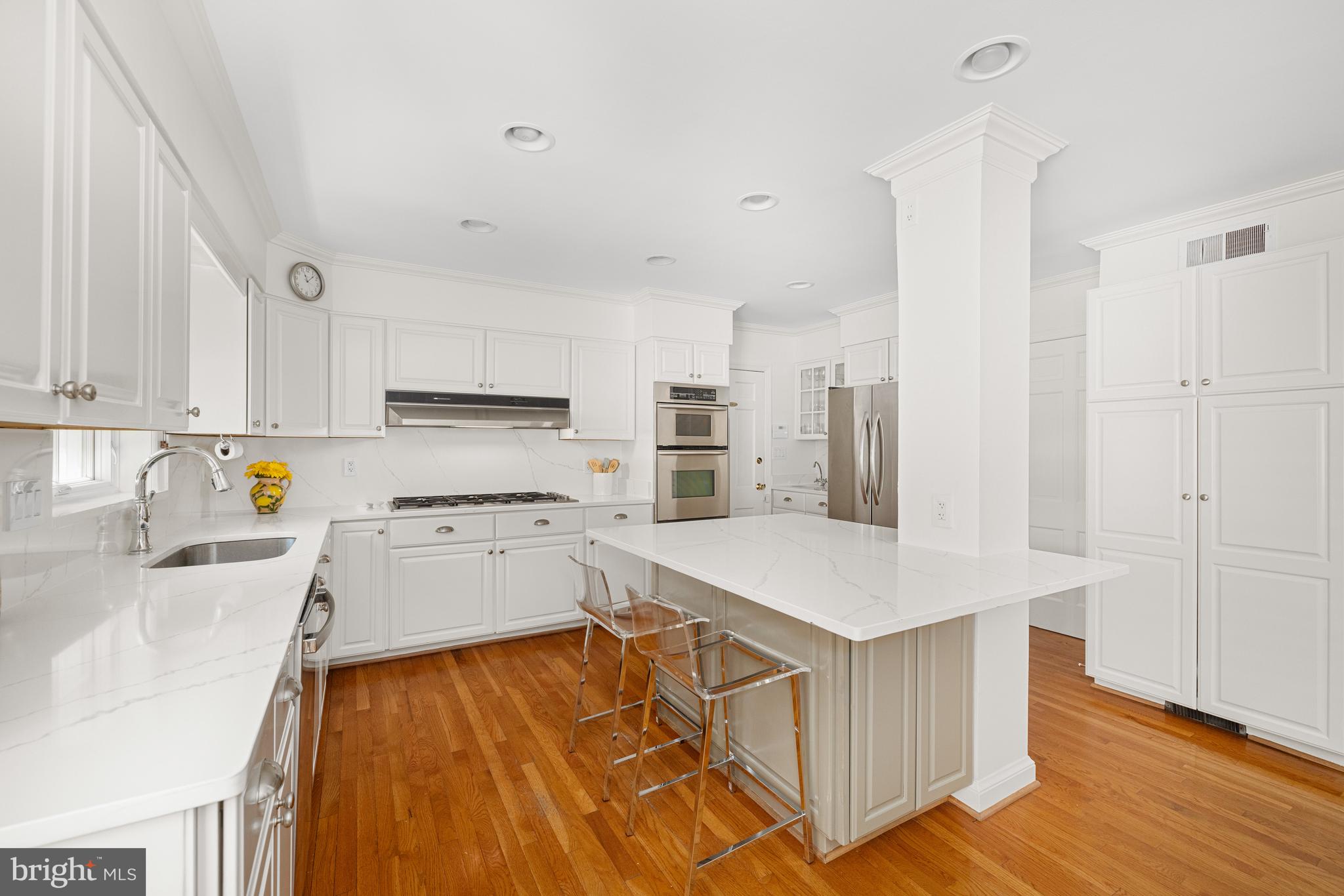 3730 Cardiff Road Chevy Chase, MD 20815 - Photo 7 of 49 a kitchen with wooden cabinets and center island