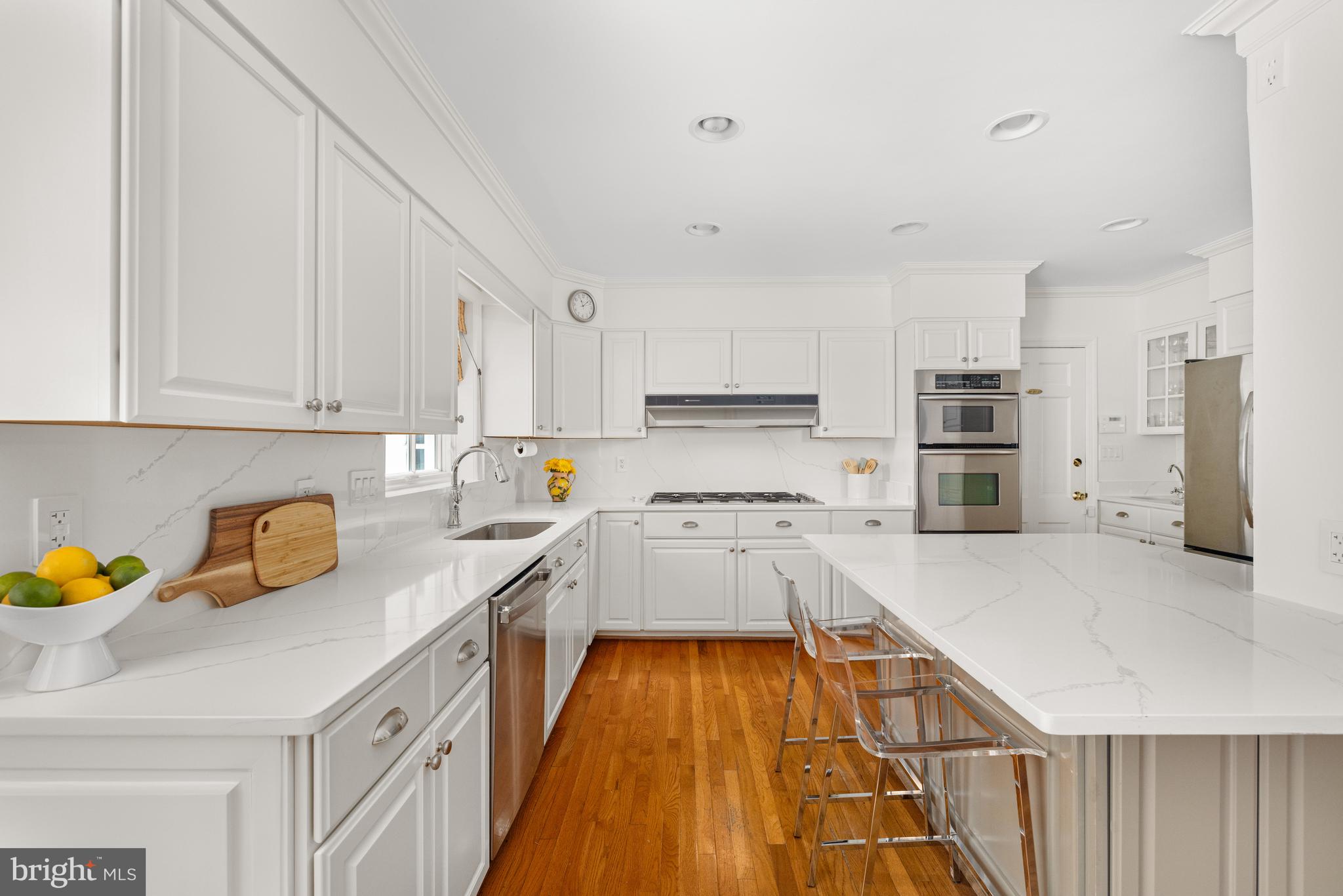 3730 Cardiff Road Chevy Chase, MD 20815 - Photo 8 of 49 a kitchen that has a lot of cabinets in it and appliances