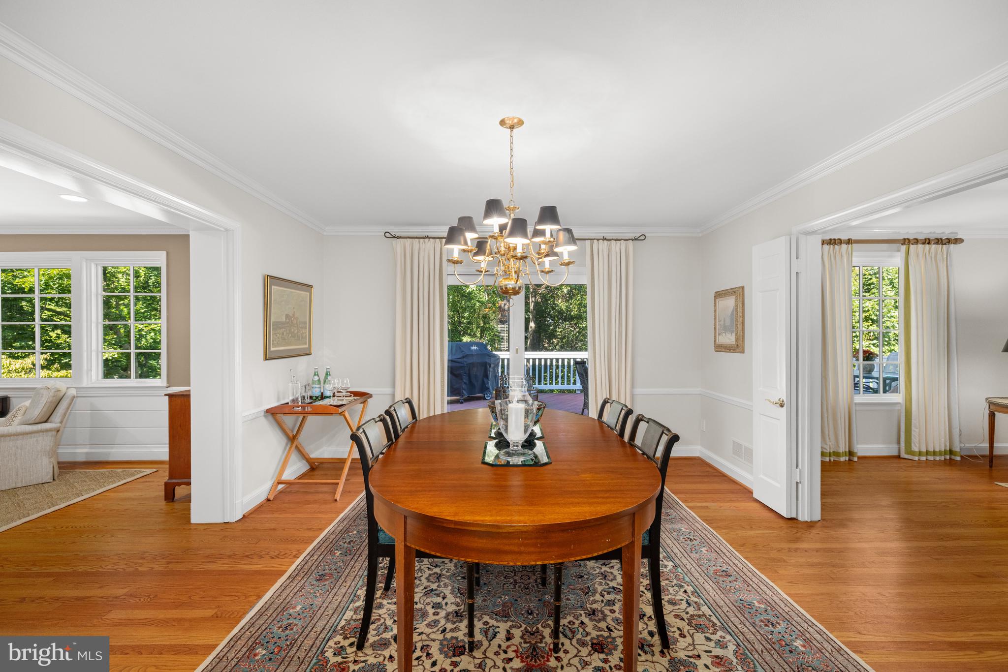 3730 Cardiff Road Chevy Chase, MD 20815 - Photo 10 of 49 a dining room with furniture a chandelier and wooden floor