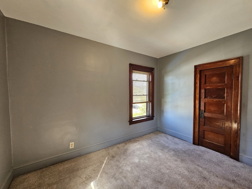30 Bemis Street, Unit 3 Chicopee, MA 01013 - Photo 20 of 26 an empty room with windows