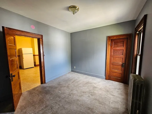 a big yard with lots of green space and fountain