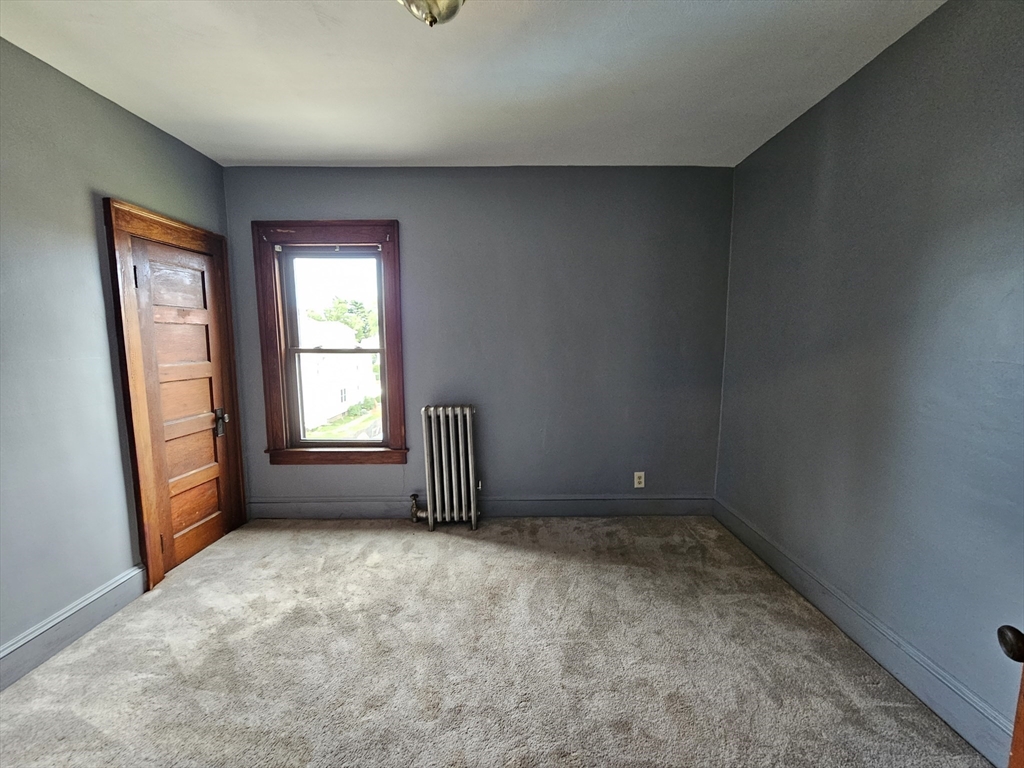 30 Bemis Street, Unit 3 Chicopee, MA 01013 - Photo 24 of 26 an empty room with windows