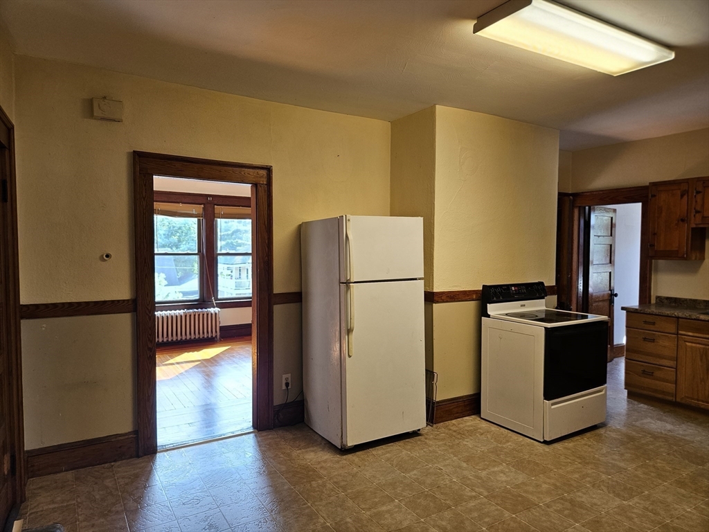 30 Bemis Street, Unit 3 Chicopee, MA 01013 - Photo 6 of 26 a kitchen with a refrigerator and a stove