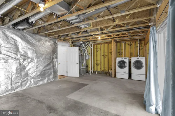 a view of a room with wooden walls