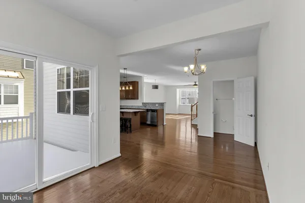 a view of kitchen with furniture and refrigerator