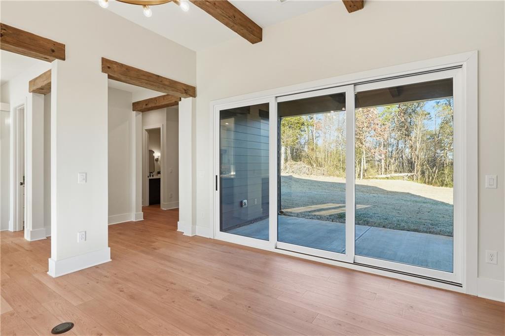 157 Palisade Drive Rydal, GA 30171 - Photo 23 of 67 a view of an empty room with wooden floor and windows