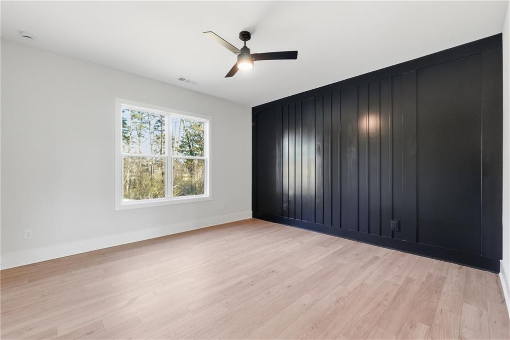 157 Palisade Drive Rydal, GA 30171 - Photo 26 of 67 an empty room with ceiling fan and windows