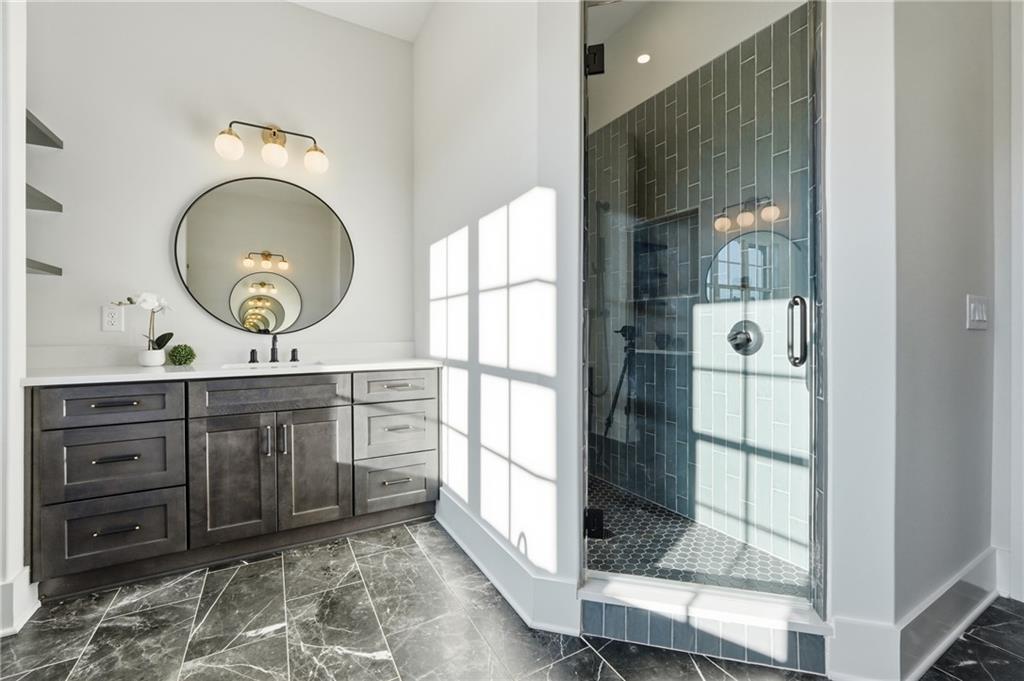 157 Palisade Drive Rydal, GA 30171 - Photo 34 of 67 a bathroom with a vanity and a mirror