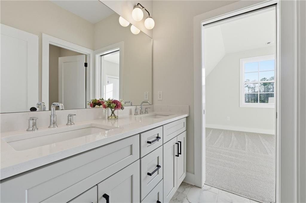 157 Palisade Drive Rydal, GA 30171 - Photo 38 of 67 a bathroom with double vanity sink a vanity and a large mirror