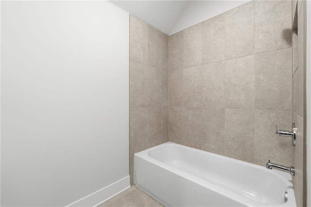157 Palisade Drive Rydal, GA 30171 - Photo 50 of 67 a bathroom with a white bath tub