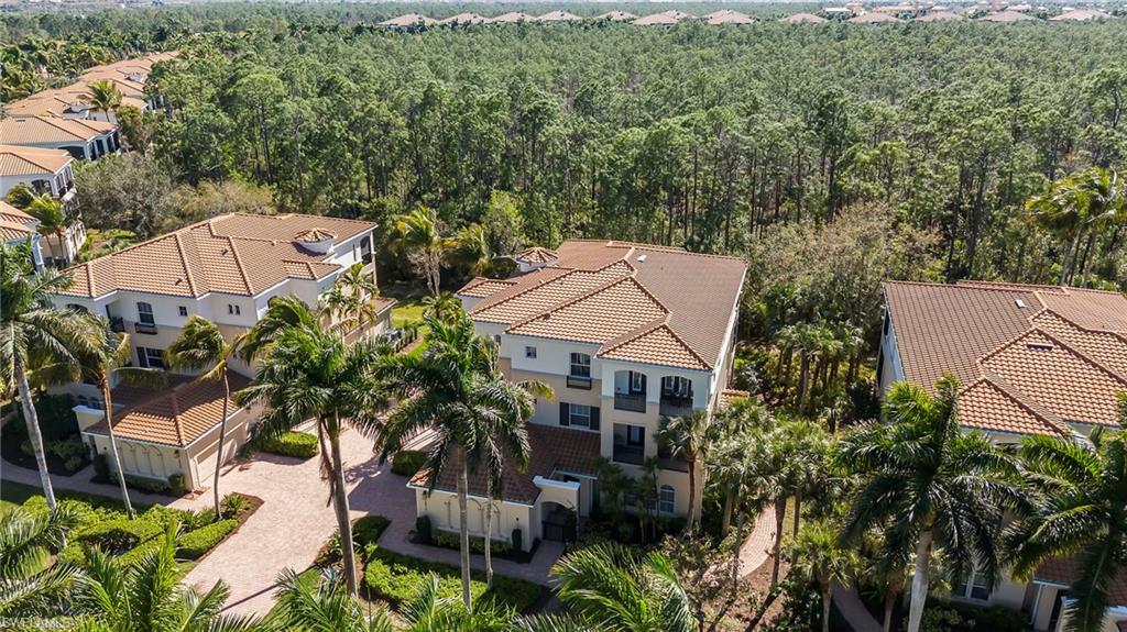 2870 Castillo Court, Unit 103 Naples, FL 34109 - Photo 27 of 34 an aerial view of a house with swimming pool and garden