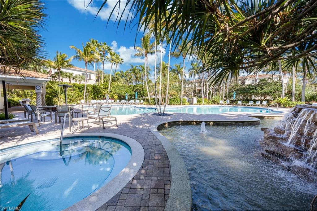 2870 Castillo Court, Unit 103 Naples, FL 34109 - Photo 33 of 34 outdoor view of swimming pool with outdoor seating