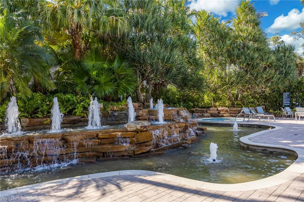 2870 Castillo Court, Unit 103 Naples, FL 34109 - Photo 34 of 34 a view of a swimming pool with sitting area