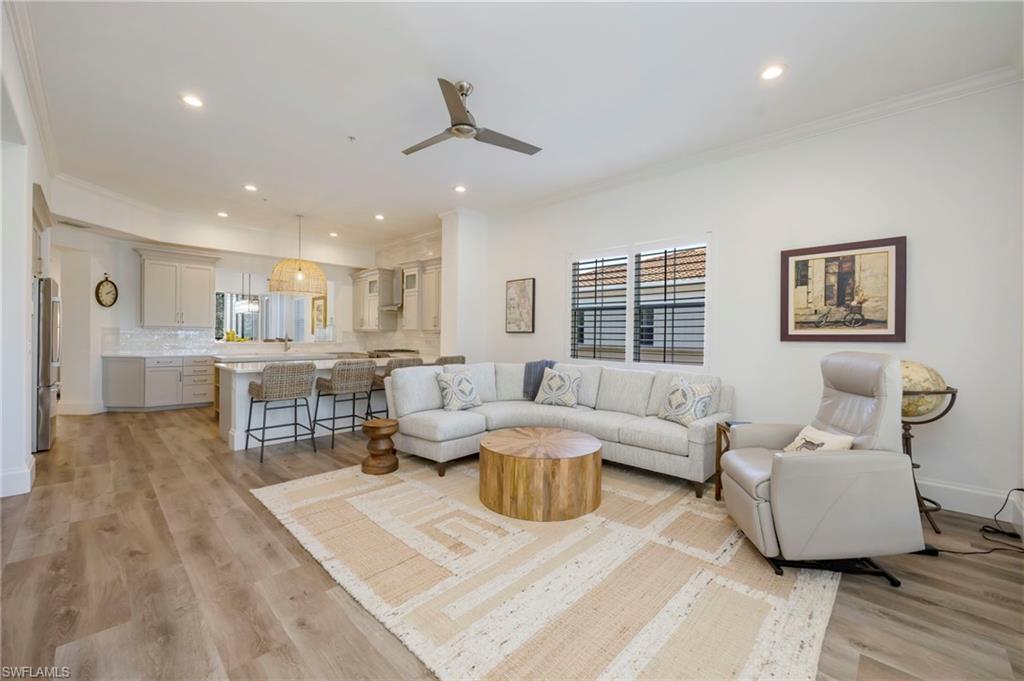 2870 Castillo Court, Unit 103 Naples, FL 34109 - Photo 5 of 34 a living room with furniture and a table