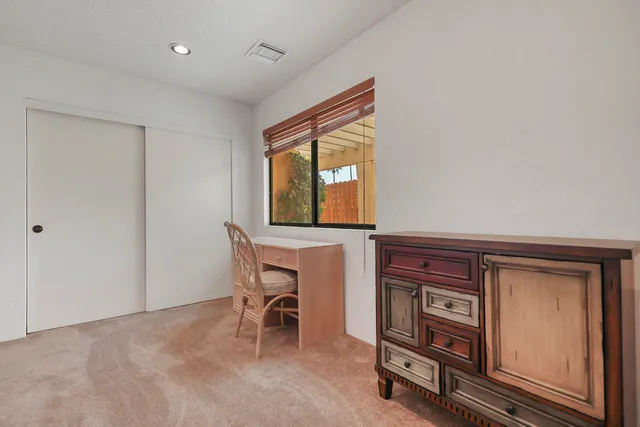 a room that has a dresser in it