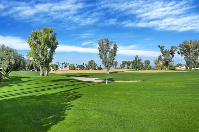 a view of a golf course with a lake