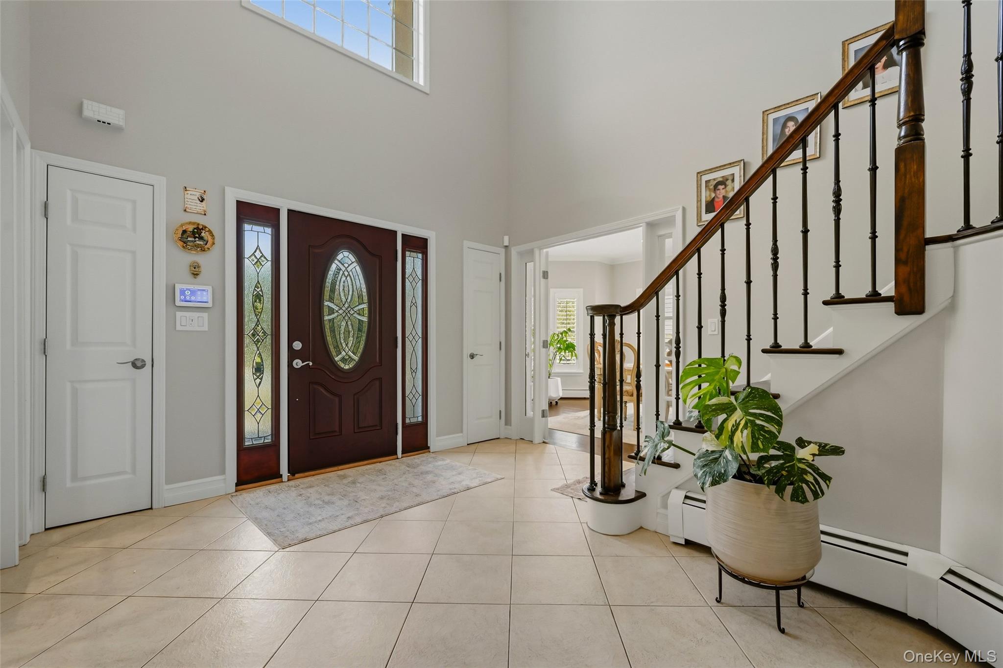51 Meriwether Trail Congers, NY 10920 - Photo 4 of 50 Two-story foyer featuring a dark wood entry door with decorative glass, side lights, and transom window