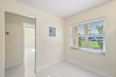 a view of an empty room with a window