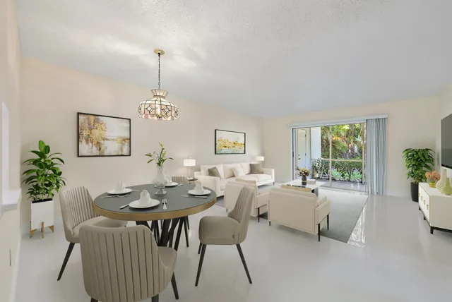 a view of a dining room with furniture window and outside view