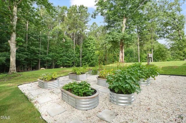 a view of a table and chairs in the garden