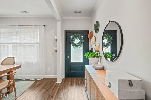 a view of a dining room with furniture and window