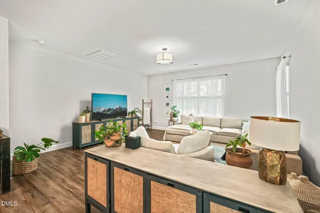 a view of a dining room with furniture window and wooden floor