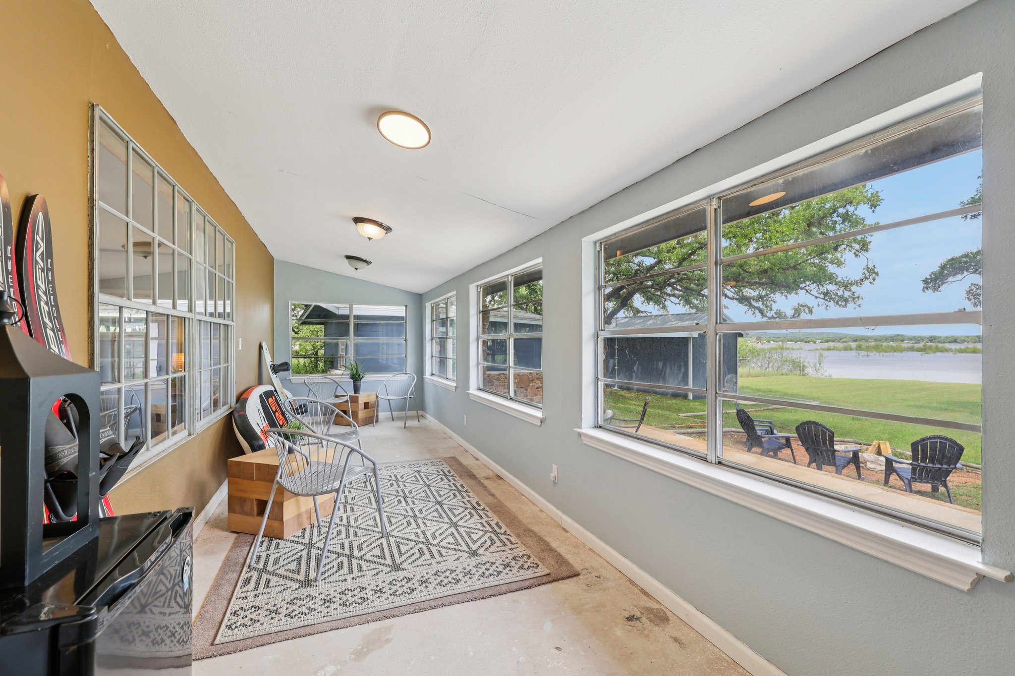 145 Oak Point Tow, TX 78672 - Photo 15 of 29 a living room with furniture and a floor to ceiling window