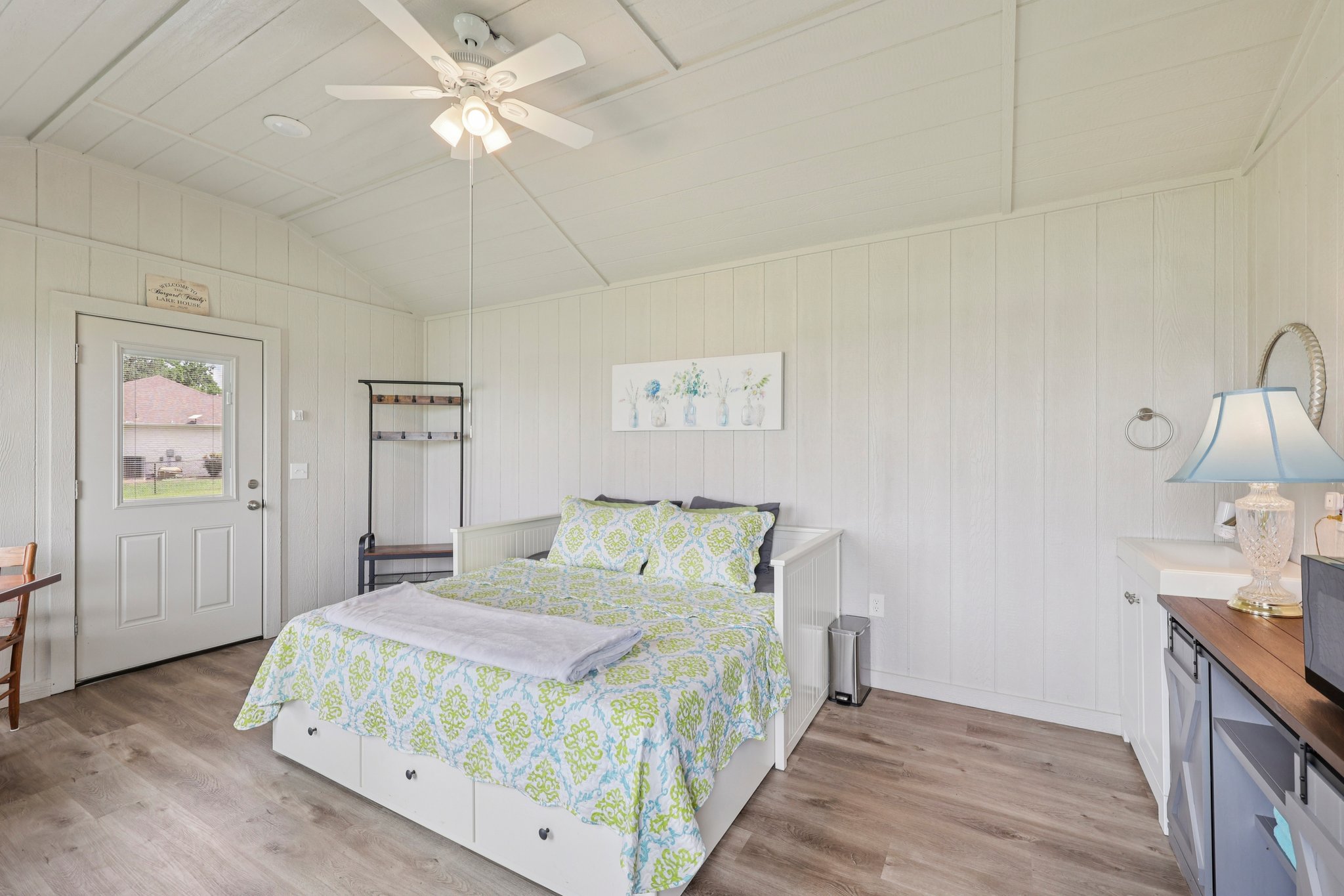 145 Oak Point Tow, TX 78672 - Photo 17 of 29 a bedroom with a bed and a chandelier