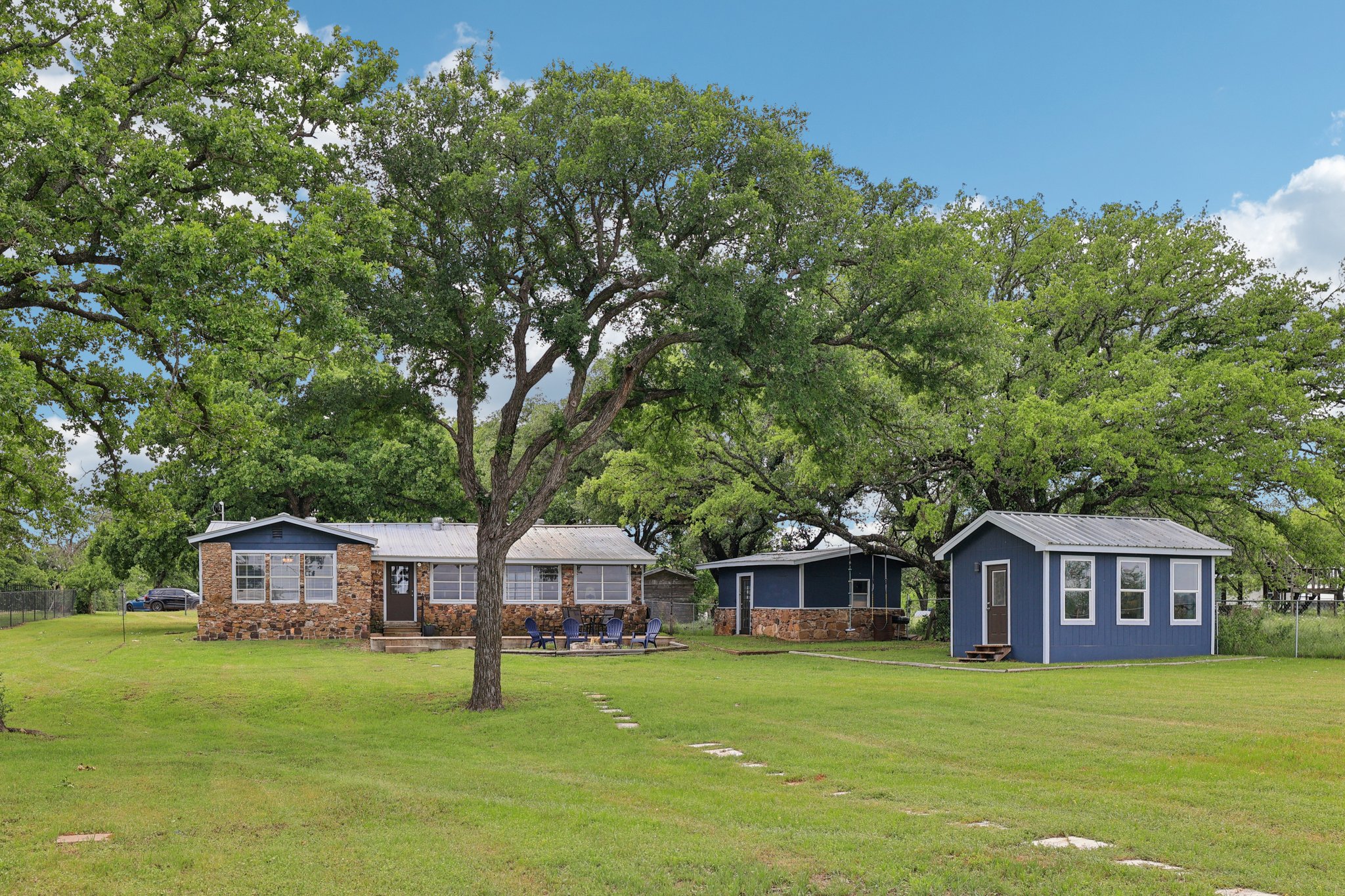 145 Oak Point Tow, TX 78672 - Photo 2 of 29 a front view of a house with garden