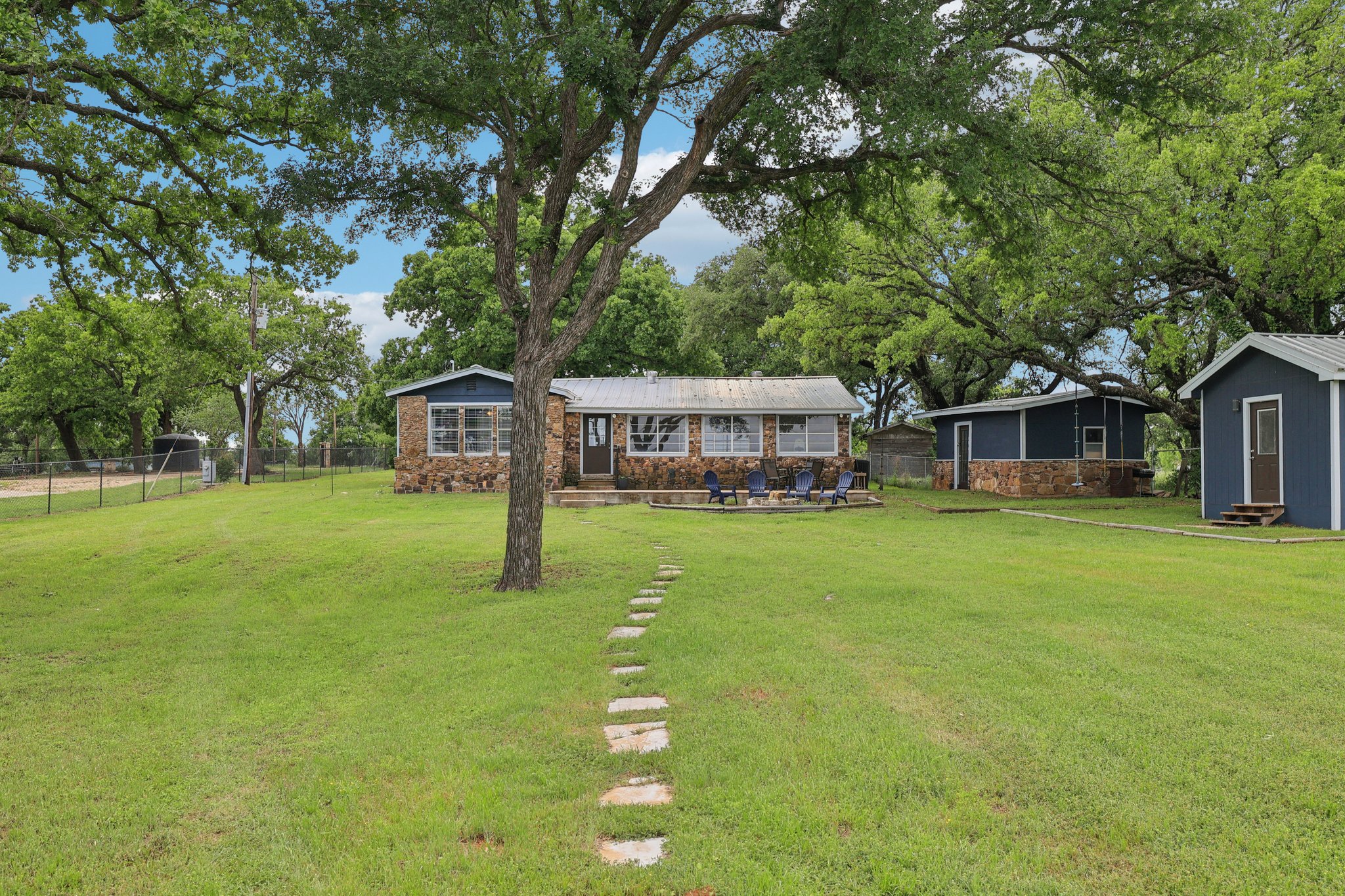 145 Oak Point Tow, TX 78672 - Photo 23 of 29 a front view of a house with garden
