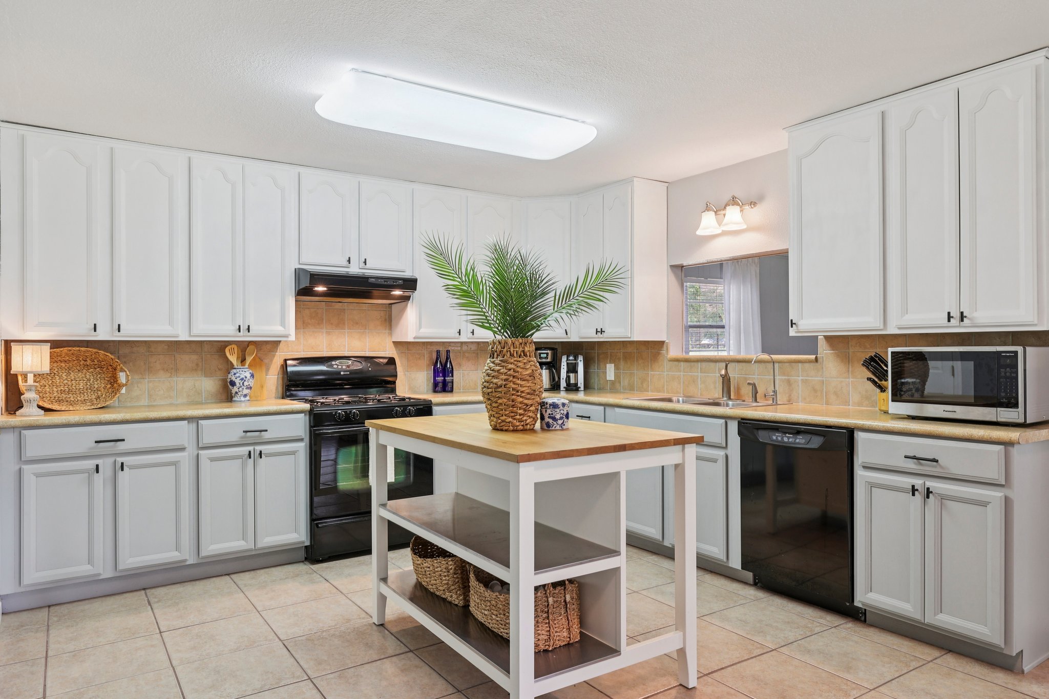 145 Oak Point Tow, TX 78672 - Photo 5 of 29 a kitchen with a stove top oven sink and cabinets