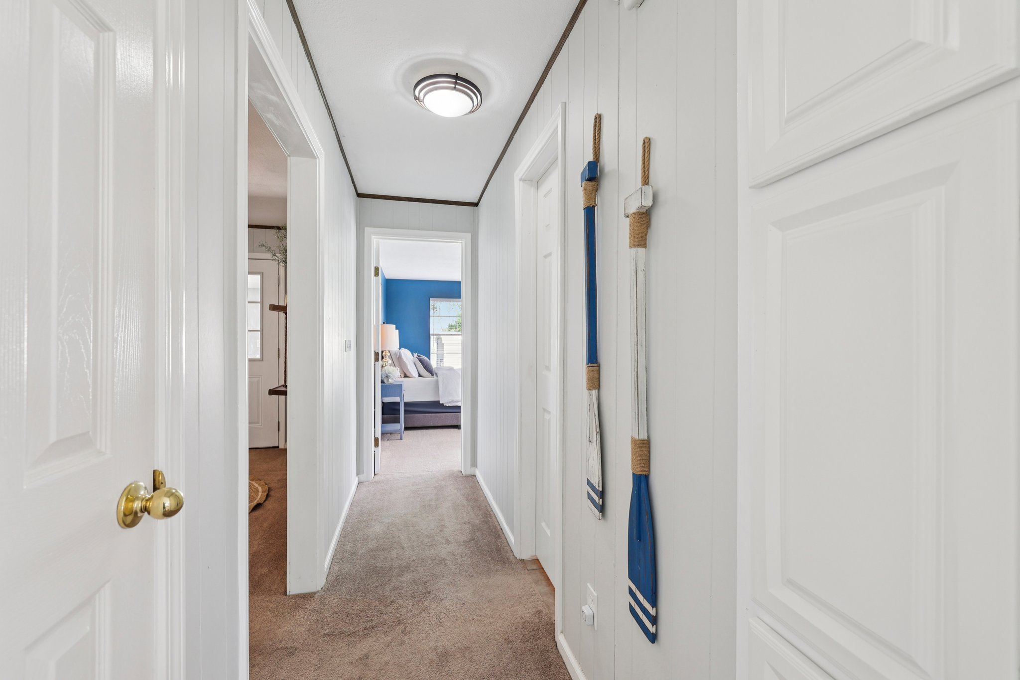 145 Oak Point Tow, TX 78672 - Photo 9 of 29 a view of a hallway with wooden floor and staircase