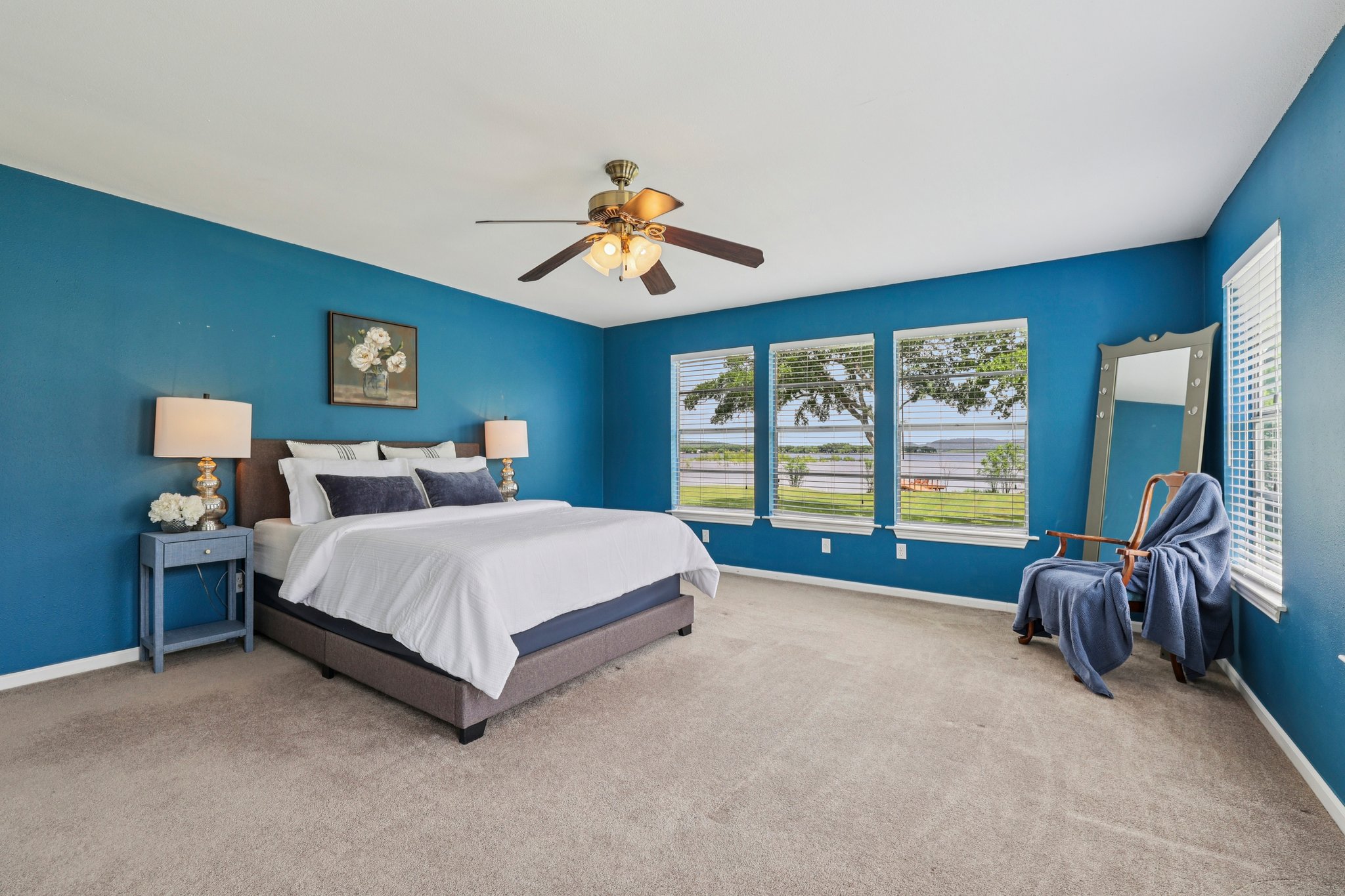 145 Oak Point Tow, TX 78672 - Photo 10 of 29 a spacious bedroom with a bed and a large window