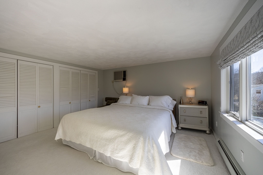 22 MacArthur Circle Peabody, MA 01960 - Photo 12 of 38 a bedroom with a bed and a window