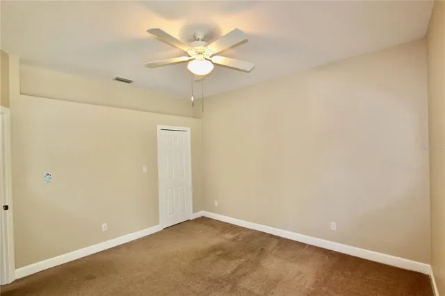 a bathroom with a granite countertop sink and a bathtub
