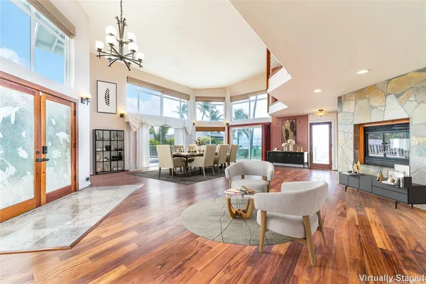 a living room with fireplace furniture and a wooden floor