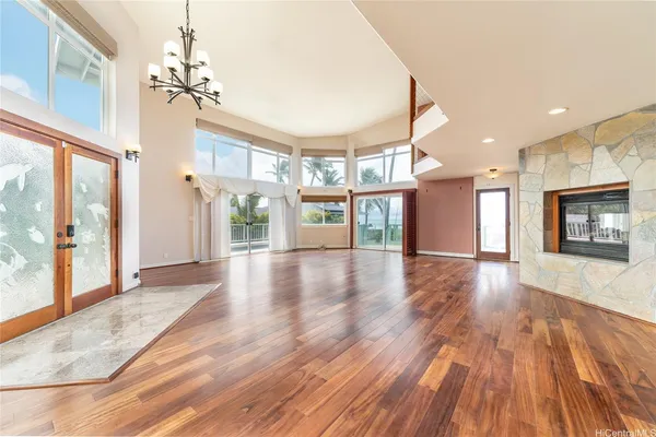 a view of an entryway with wooden floor and door