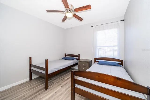 a bedroom with furniture and a window