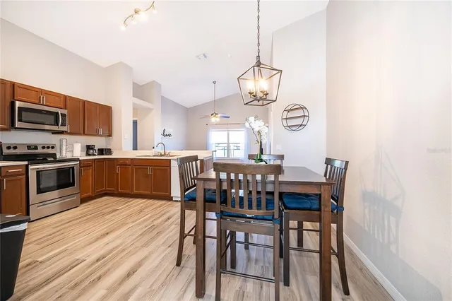 a view of kitchen with sink and wooden floor