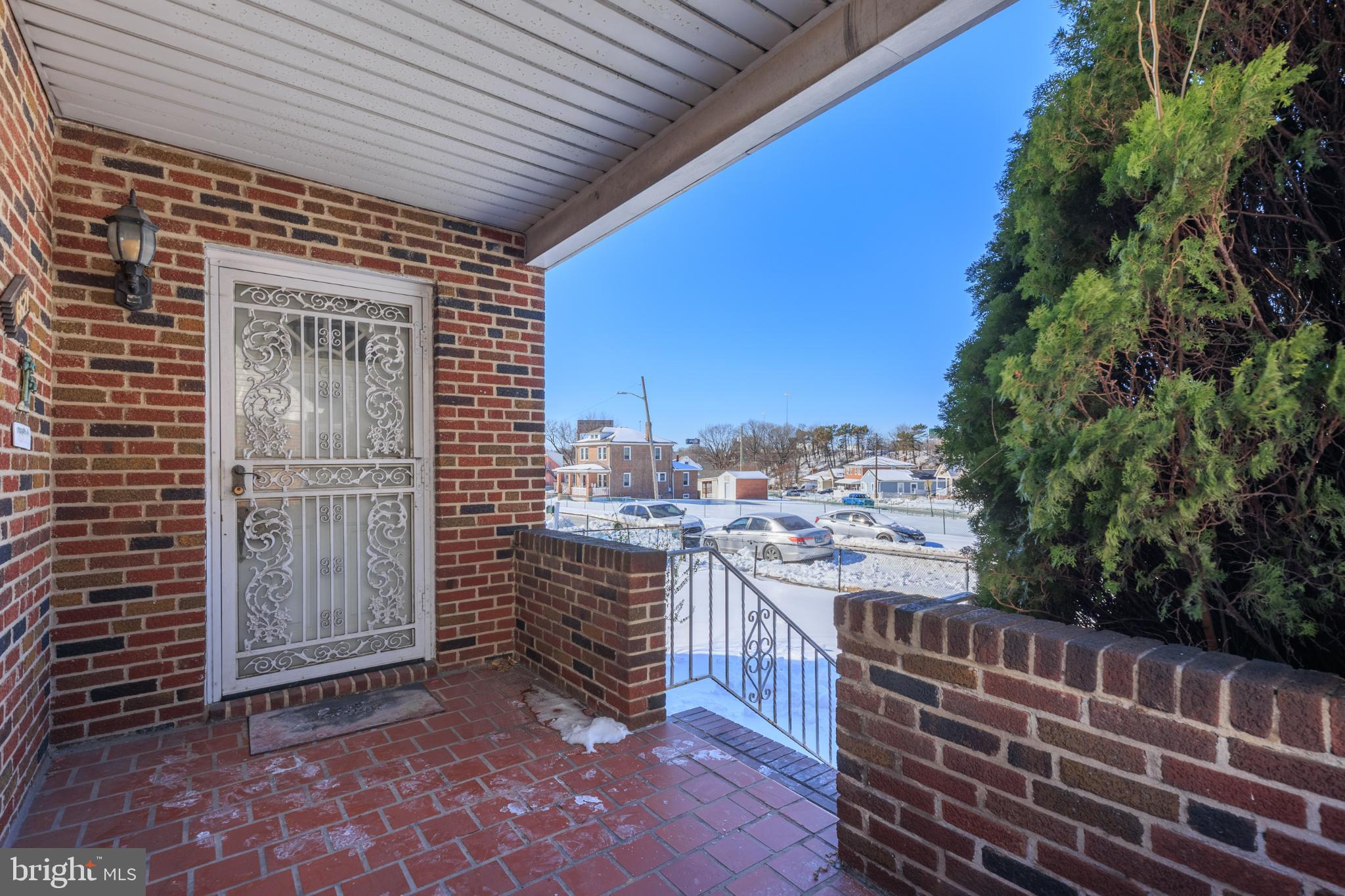 6627 Bushey Street Baltimore, MD 21224 - Photo 25 of 33 Charming entryway with brick accents.